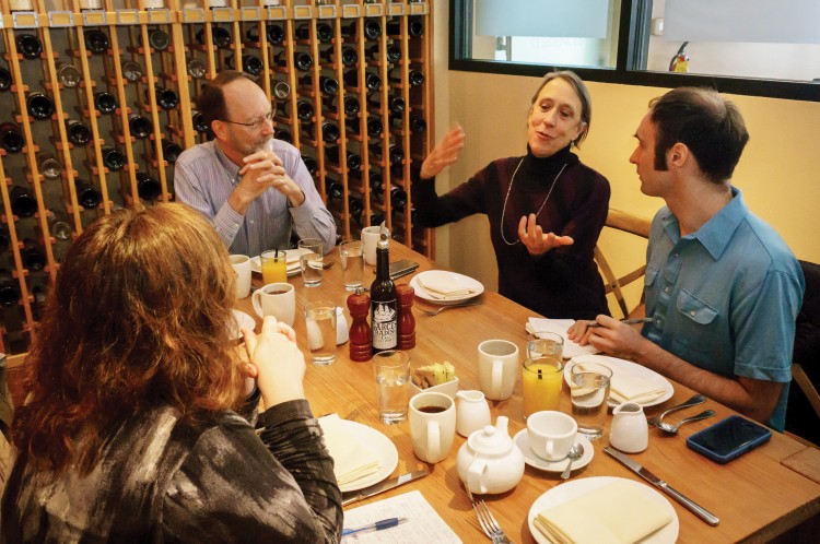 Artistic directors Bob Wiemken, second from left, and Joan Kimball in a meeting with choreographer Christopher Williams and executive director Shannon Cline.
