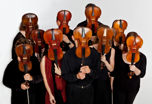 Tempestra strings stand behind their instruments. (Andy Kahl)