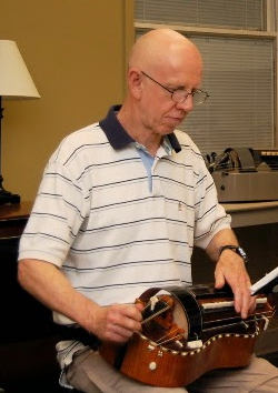 Author Green with hurdy-gurdy.