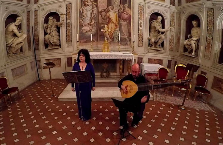 Soprano Jessica Gould and chitarrone player Diego Cantalupi at La Cappella di San Luca in Basilica della Santissima Annunziata in Florence, Italy.