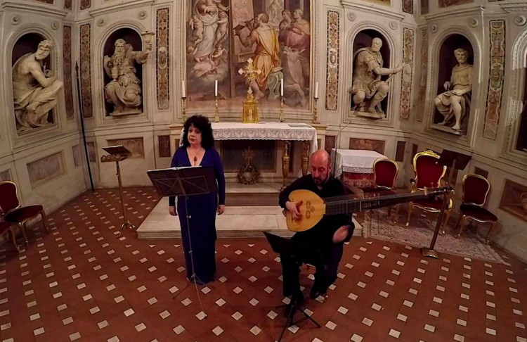 Soprano Jessica Gould and chitarrone player Diego Cantalupi at La Cappella di San Luca in Basilica della Santissima Annunziata in Florence, Italy. 