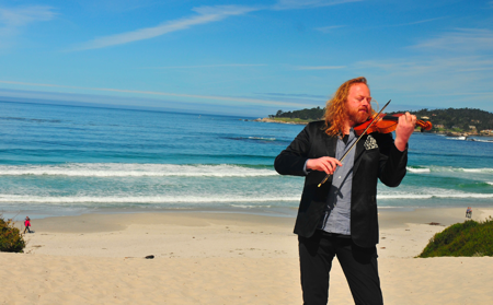 Violinist Edwin Huizinga on the beach. (Avery Gould)