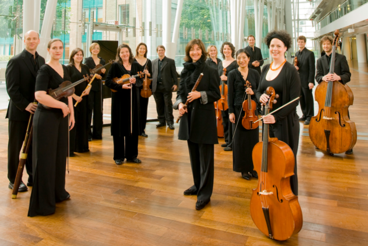 The Montreal-based Arion Baroque Orchestra is led by flutist Claire Guimond, center.