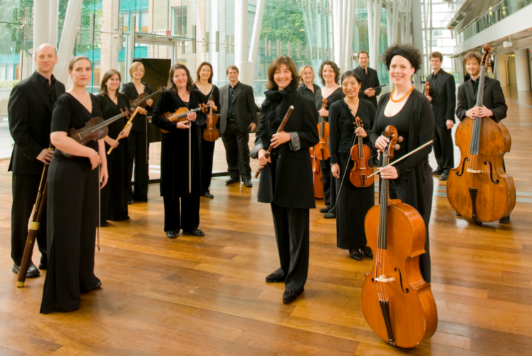 The Montreal-based Arion Baroque Orchestra is led by flutist Claire Guimond, center. 