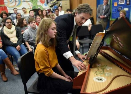 Aymeric Dupré la Tour coaches eigth-grade harpsichord student Addie Clark.