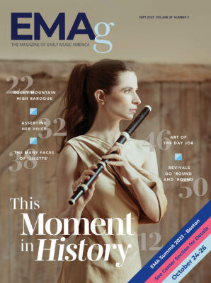magazine cover with image of woman holding a flute